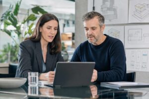 UK Chief Information Officer and Chief Technology Officer collaborating in a modern boardroom